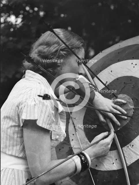 Chase, Diana, Miss, doing archery, 1933 June 22. Creator: Arnold Genthe.