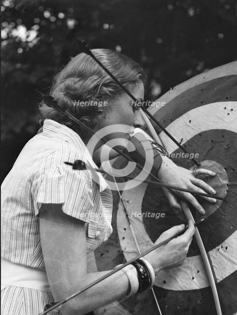 Chase, Diana, Miss, doing archery, 1933 June 22. Creator: Arnold Genthe.