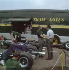 Chapman and Clark outside the Lotus team bus, French Grand Prix, Clermont-Ferrand, France, 1965