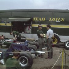 Chapman and Clark outside the Lotus team bus, French Grand Prix, Clermont-Ferrand, France, 1965