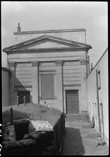 Chapel at Hull Trinity House and statue outside east front, Kingston upon Hull, 1941. Creator: George Bernard Wood