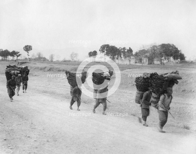 Charcoal bearers on the road to Peking, China, late 19th or early 20th century. Artist: Unknown