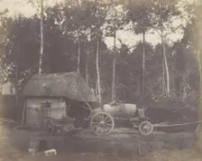 Charette devant l'entrée d'un abri au toit de chaume, 1850-53. Creator: Unknown