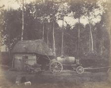 Charette devant l'entrée d'un abri au toit de chaume, 1850-53. Creator: Unknown