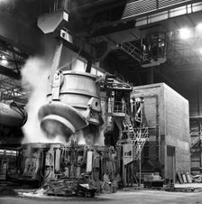 Charging a furnace, Park Gate Iron & Steel Co, Rotherham, South Yorkshire, 1964. Creator: Michael Walters