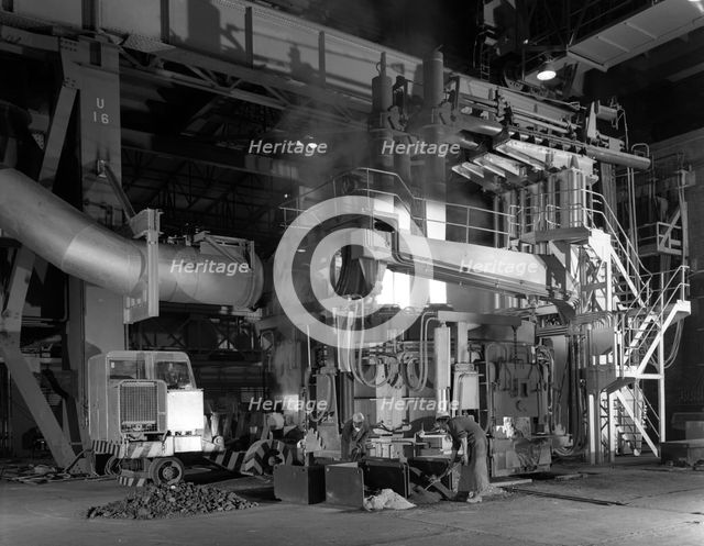 Charging an electric arc furnace, Park Gate Iron & Steel Co, Rotherham, South Yorkshire, 1964. Creator: Michael Walters.