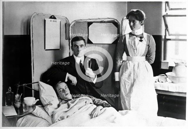 Charing Cross Hospital: Basil Hood with patient, 1904. Creator: Unknown.