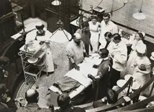 Charing Cross Hospital: Stanley Boyd in the old operating theatre, 1900. Creator: Unknown
