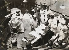 Charing Cross Hospital: Stanley Boyd in the old operating theatre, 1900. Creator: Unknown