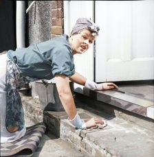 Charlady scrubbing steps, c1955. Creator: Arthur Charles Kirby Ware