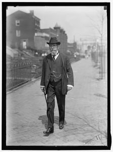 Charles Evans Hughes walking away from Union Station, Washington, D.C..., between 1913 and 1917. Creator: Harris & Ewing