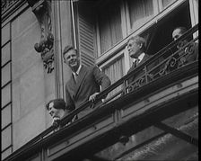 Charles Lindbergh and Anne Morrow Lindbergh On a Balcony Waving To the Press and Crowds, 1927. Creator: British Pathe Ltd