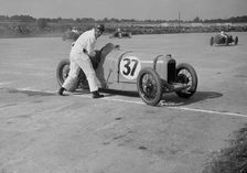 Charles Martin restarting his Amilcar after skidding, JCC 200 Mile Race, Brooklands, 1926. Artist: Bill Brunell