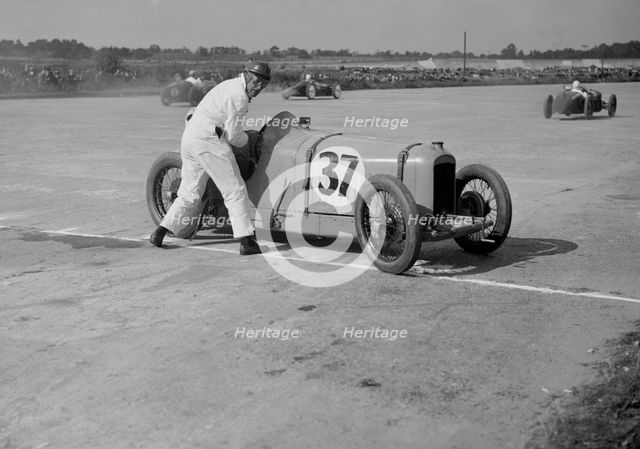 Charles Martin restarting his Amilcar after skidding, JCC 200 Mile Race, Brooklands, 1926. Artist: Bill Brunell.