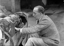 Charles Mortimer working on the engine of a MG KN Special, c1930s Artist: Bill Brunell
