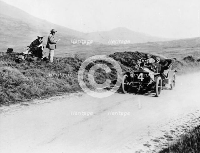 Charles Rolls on the way to winning the Isle of Man TT race in a 20 hp Rolls-Royce, 1906. Artist: Unknown