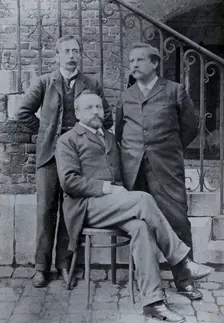 Charles Sherrington (left), Leon Fredericq (seated) and Paul Grützner (right) outside the...(1940?). Creator: Unknown