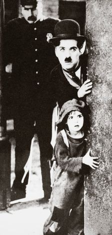 Charlie Chaplin and Jackie Coogan in The Kid 1921. Creator: Unknown