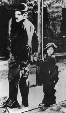 Charlie Chaplin and Jackie Coogan in The Kid 1921. Creator: Unknown