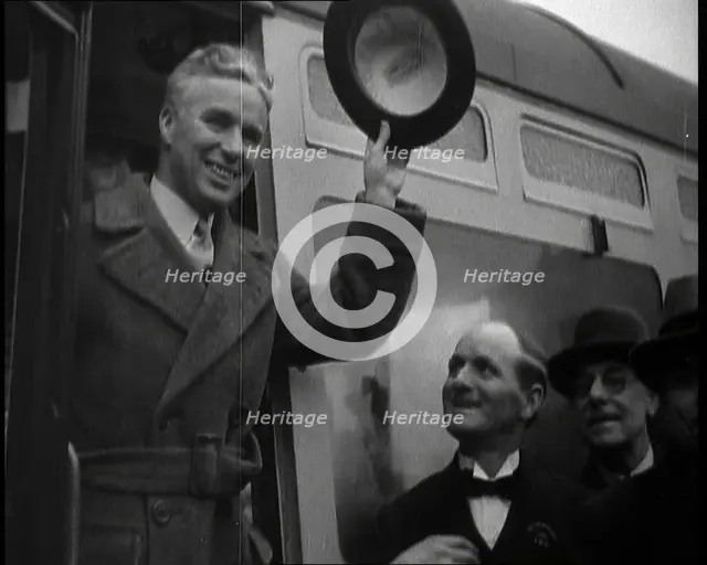 Charlie Chaplin Greeting Onlookers from a Train, 1930s. Creator: British Pathe Ltd.
