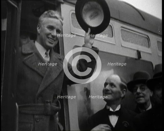 Charlie Chaplin Greeting Onlookers from a Train, 1930s. Creator: British Pathe Ltd.
