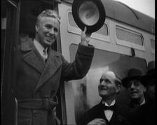 Charlie Chaplin Greeting Onlookers from a Train, 1930s. Creator: British Pathe Ltd