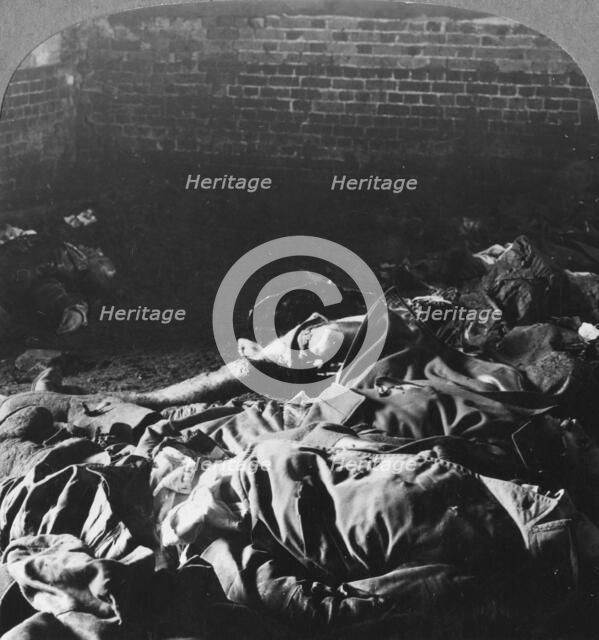 Charred bodies of the crew of a Zeppelin shot down over Billericay, Essex, World War I, 1916. Artist: Realistic Travels Publishers