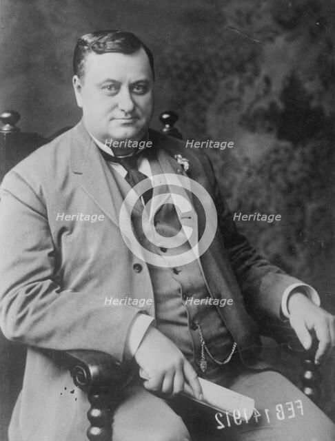 Chas. E. Piper, seated, 1912. Creator: Bain News Service.