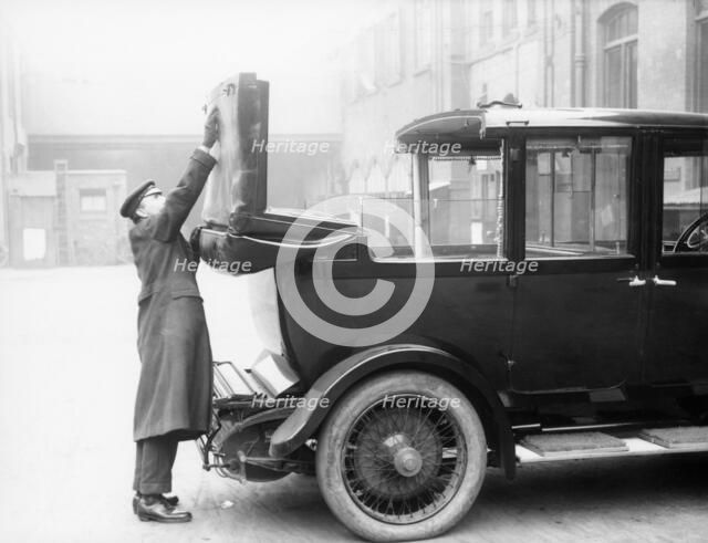 Chauffeur with a partly convertible Daimler. Artist: Unknown
