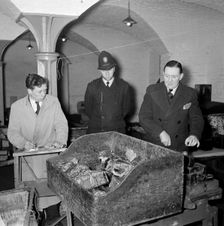 Checking packages at the East India Company Warehouses, Cutler Street, London, c1945-c1965. Artist: SW Rawlings