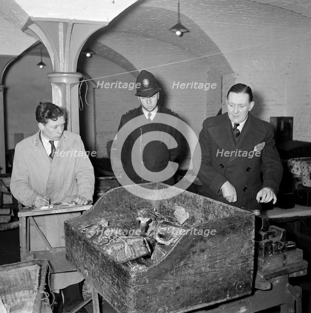 Checking packages at the East India Company Warehouses, Cutler Street, London, c1945-c1965. Artist: SW Rawlings
