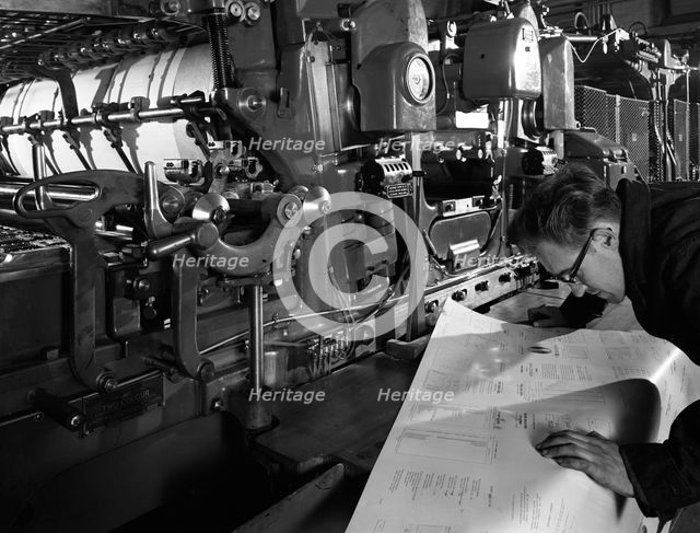 Checking printed pages from a two colour press, Mexborough, South Yorkshire, 1959. Creator: Michael Walters.
