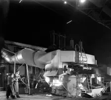 Checking the temperature of molten steel, Sheffield, South Yorkshire, 1964. Creator: Michael Walters