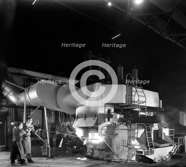 Checking the temperature of molten steel, Sheffield, South Yorkshire, 1964. Artist: Michael Walters