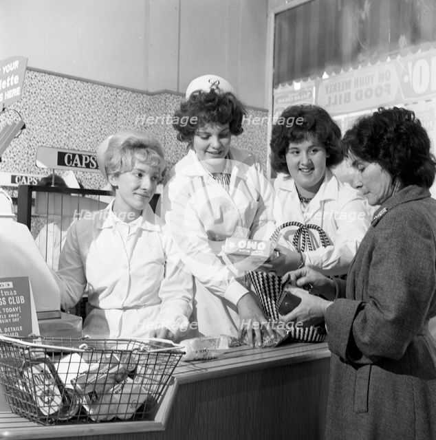 Checkout girls at a supermarket opening, Brough's Ltd, Thurnscoe, South Yorkshire, 1963. Creator: Michael Walters.