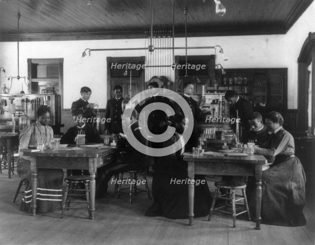 Chemistry classroom at Hampton Institute - African American male and female students, 1899 or 1900. Creator: Frances Benjamin Johnston.