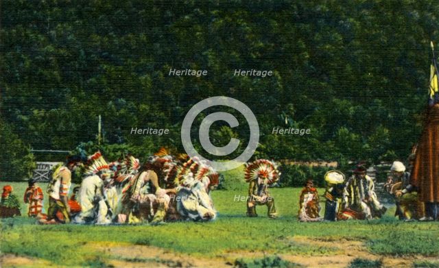 'Cherokee Indians in Full Native Costume in one of their Ceremonial Dances - On Cherokee Indian Rese Creator: Unknown.