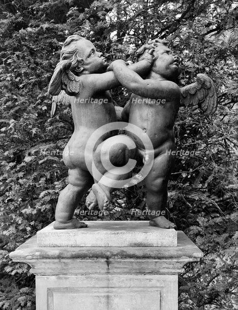 'Cherubs - the Quarrel', statue in the gardens of Melbourne Hall, Derbyshire, 1954. Artist: GB Mason.