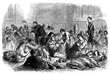 Chicago after the Fire: burnt-out people in the chapel of Grace Church, 1871. Creator: Unknown