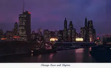 Chicago River and city skyline at night, Illinois, USA, 1957