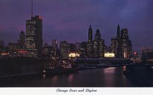 Chicago River and city skyline at night, Illinois, USA, 1957