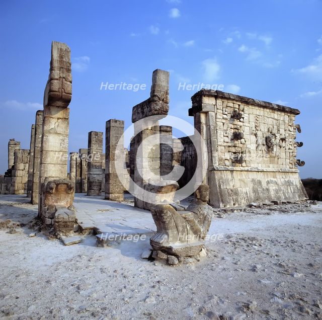 Chichen Itza, view of Temple of the Warriors, with a sculpture in foreground.