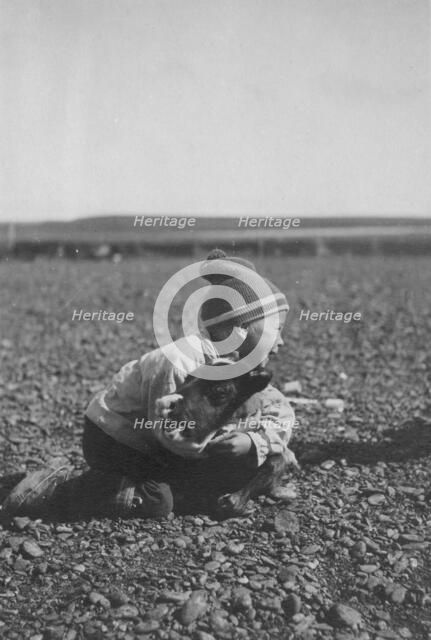 Child and calf, between c1900 and c1930. Creator: Unknown.