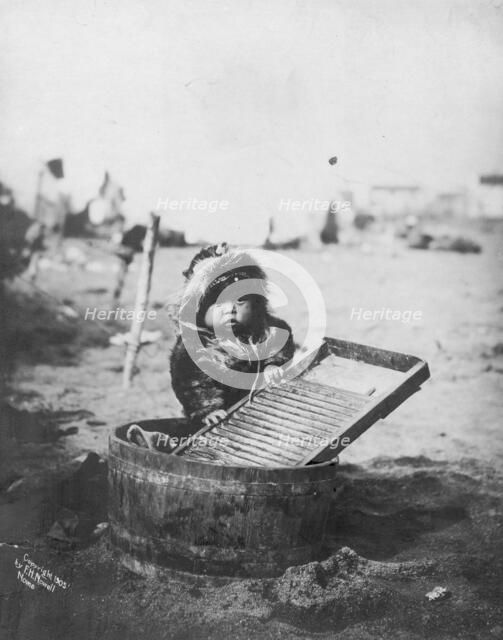 Child at washtub, c1905. Creator: Frank H. Nowell.