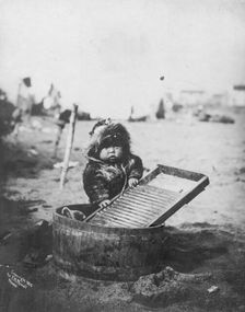 Child at washtub, c1905. Creator: Frank H. Nowell