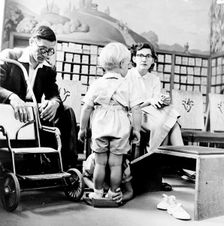 Child being fitted for new shoes in a London shoe shop, c1950s. Creator: Henry Grant