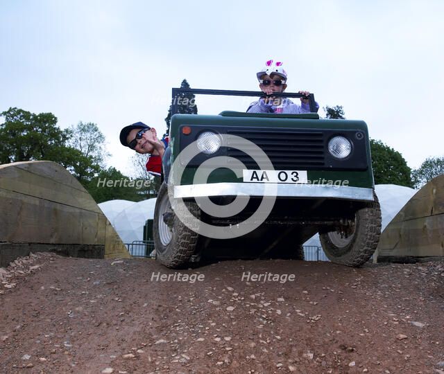 Child driving a toy Land Rover. Artist: Unknown.