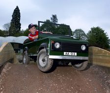 Child driving a toy Land Rover