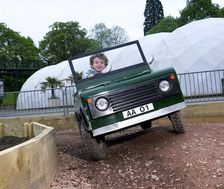 Child driving a toy Land Rover