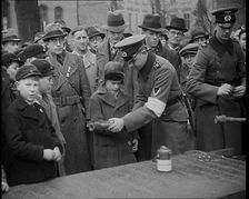 Child Holding a Hand Grenade, 1930s. Creator: British Pathe Ltd
